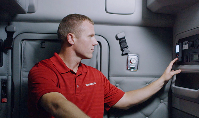 Kenworth employee adjusting temperature in cabin